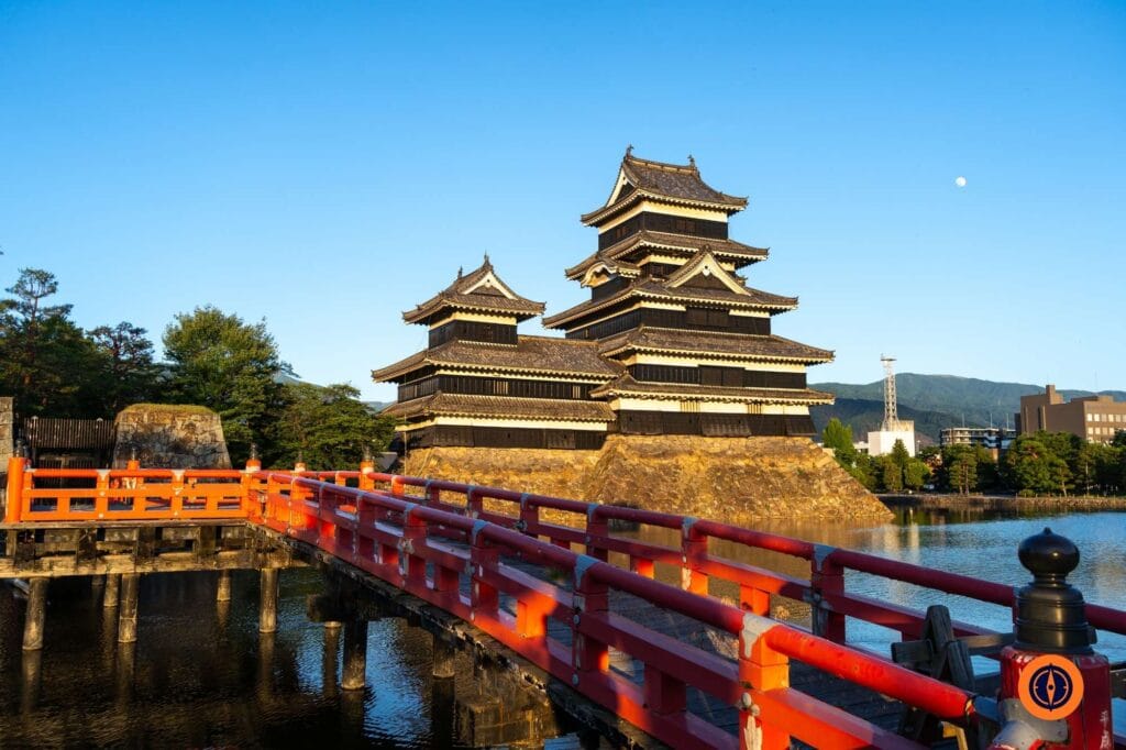 Matsumoto Castle and red bridge at sunset, Japan